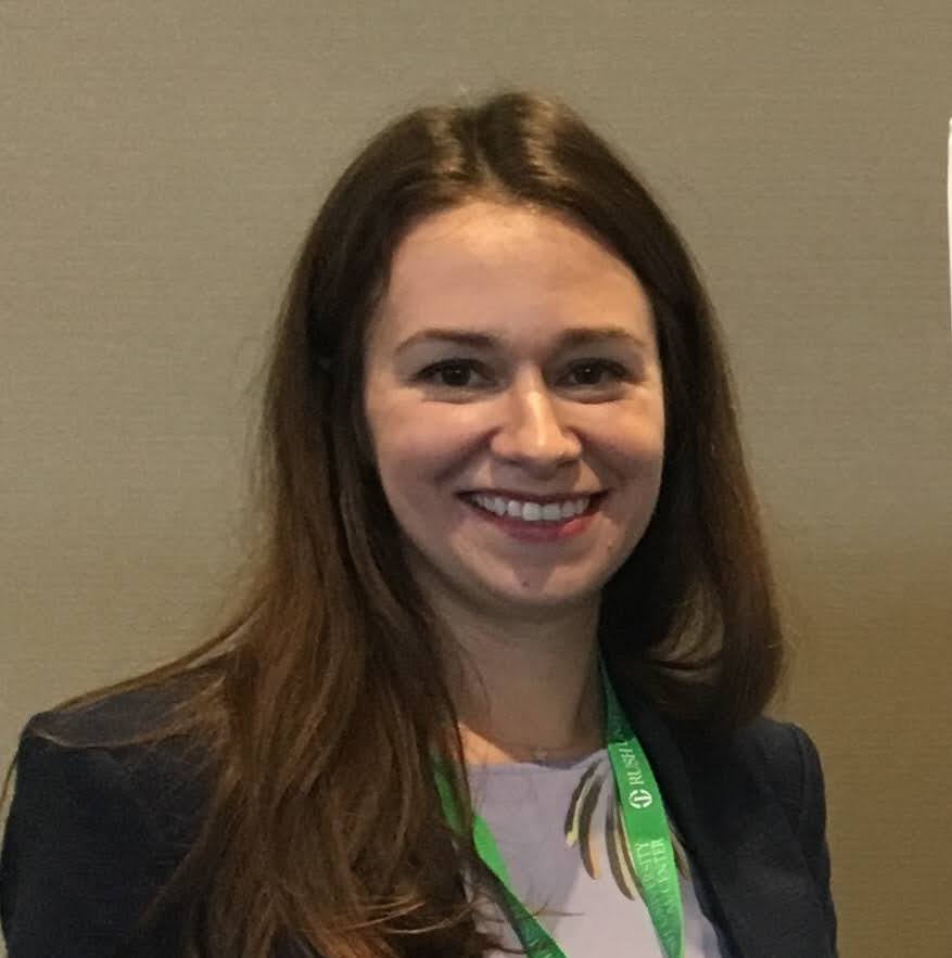 A smiling black woman in a natural background