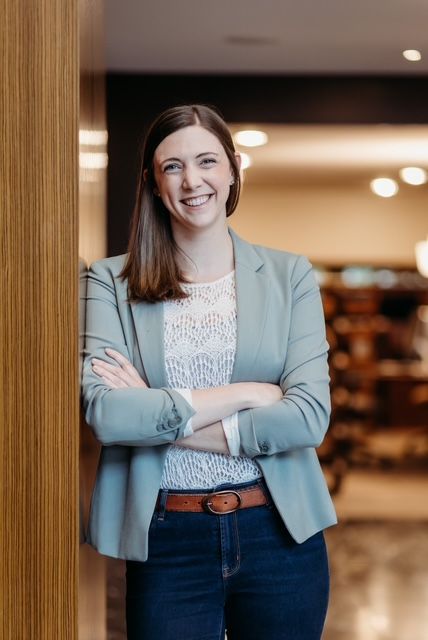 A smiling black woman in a natural background