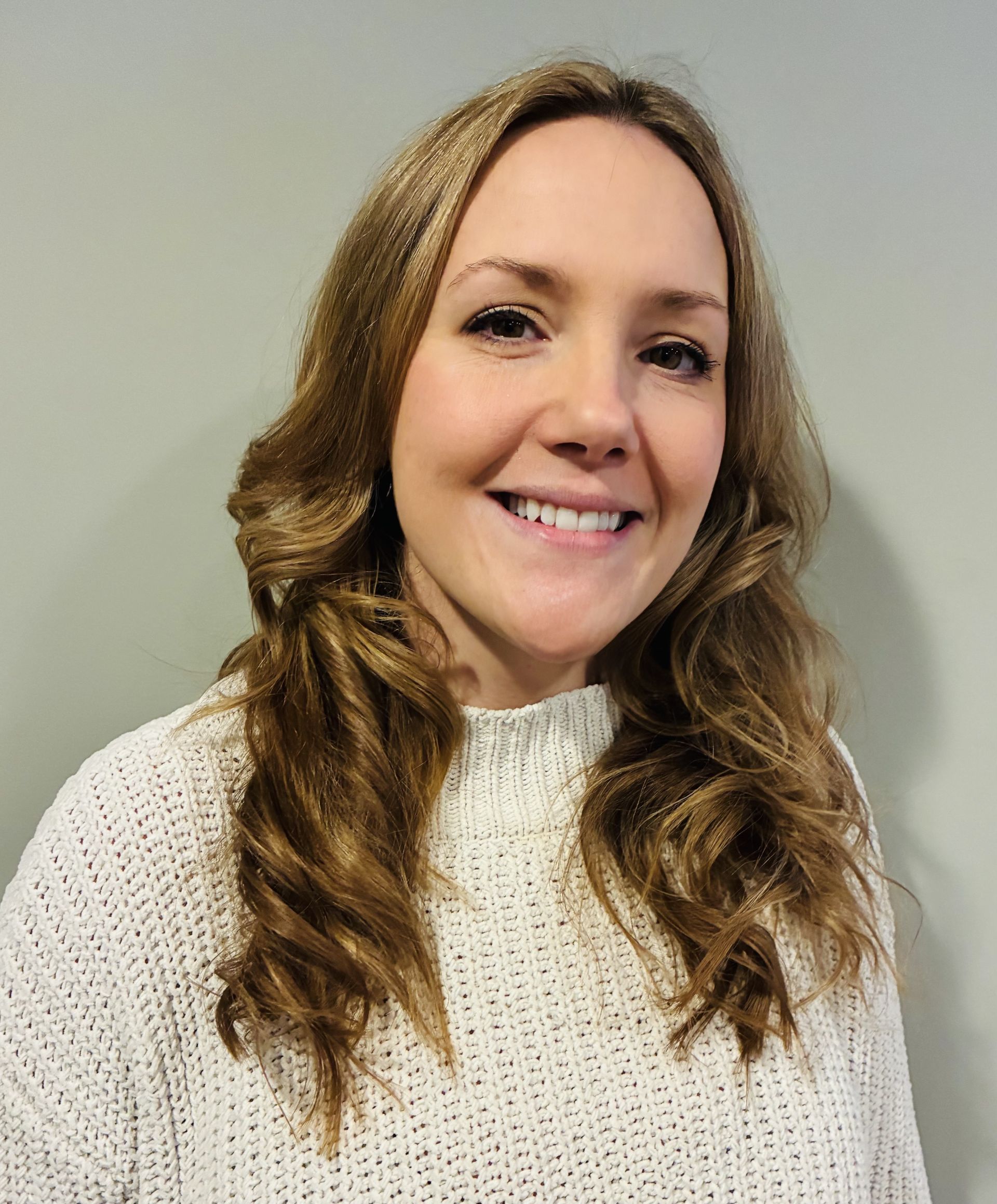 A smiling black woman in a natural background