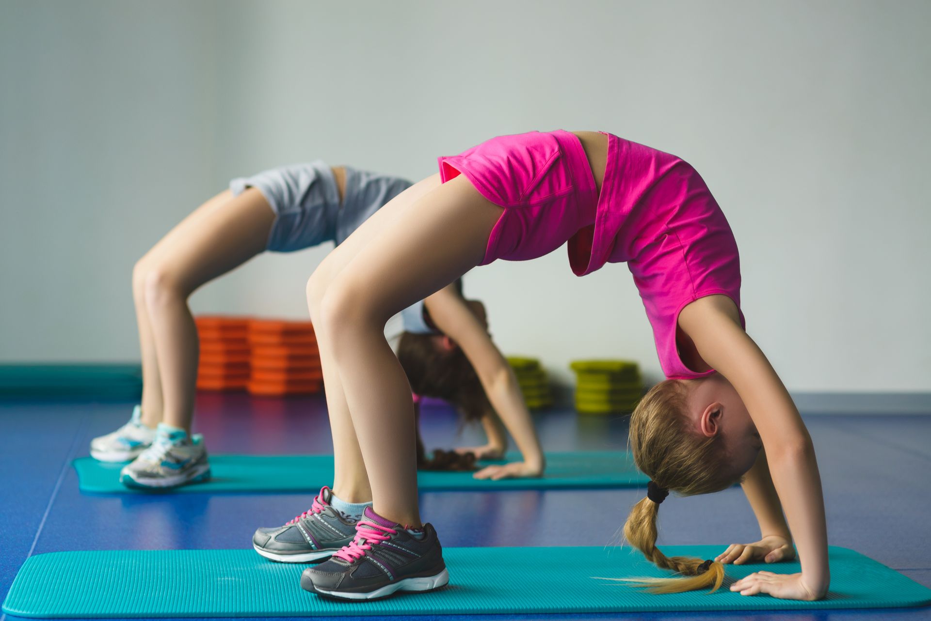Young gymnast practicing a skill at home