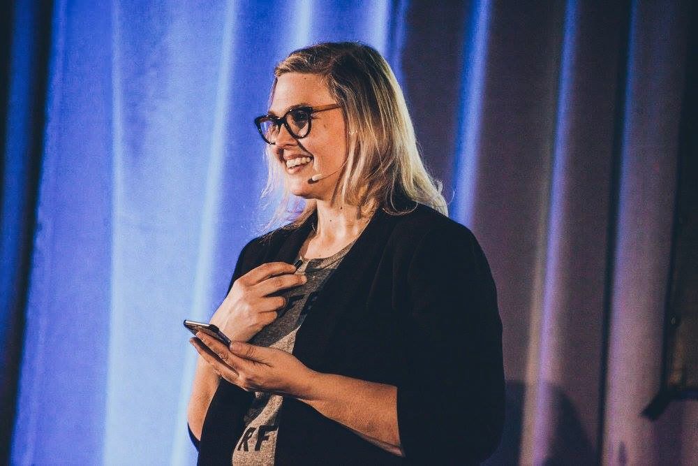 Tracey Falk speaking at a marketing conference