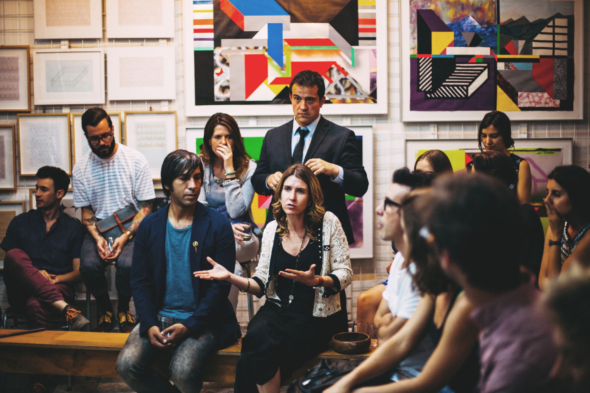 Group of people sitting in a circle having a discussion