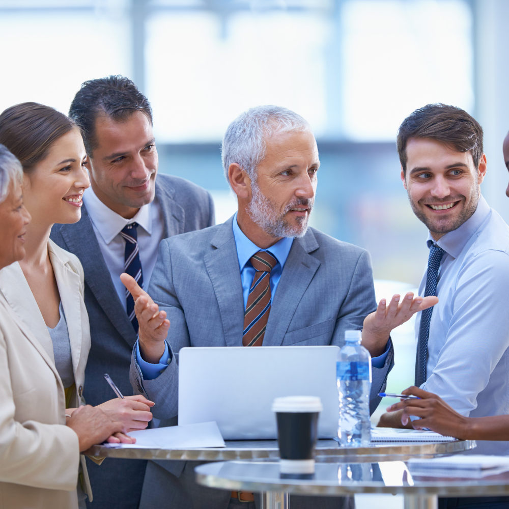 Group of entrepreneurs pointing at a screen