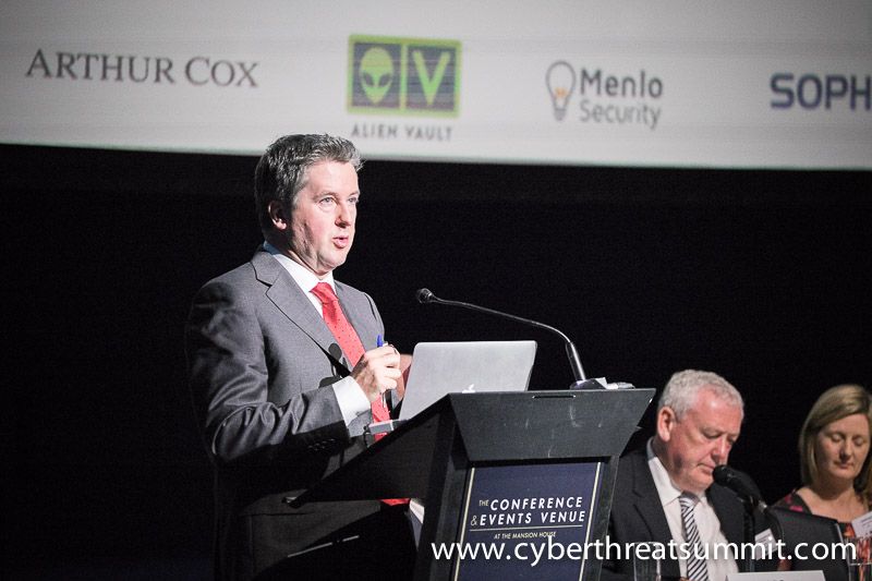 A delegate putting a question to the stage at an ICTTF event