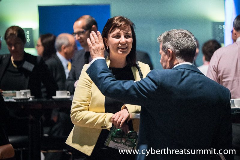 Paul C. Dwyer in conversation with a delegate at an ICTTF event