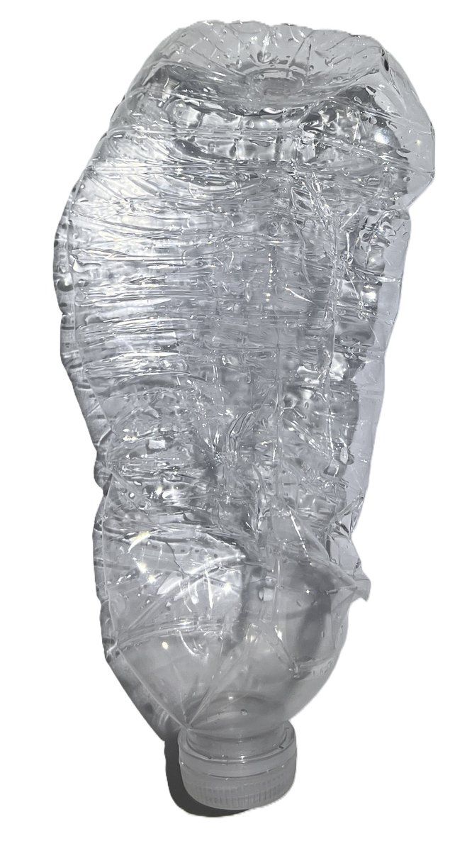 A clear plastic water bottle that has visibly collapsed and crumpled inward, photographed against a black background, illustrating how external pressure forces volume down when a sealed container can't push back.