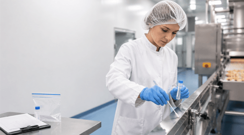 A food industry Lab technician taking Environmental Monitoring Sample as part of their training in a dairy factory - Food Surety Limited Training for BRCGS