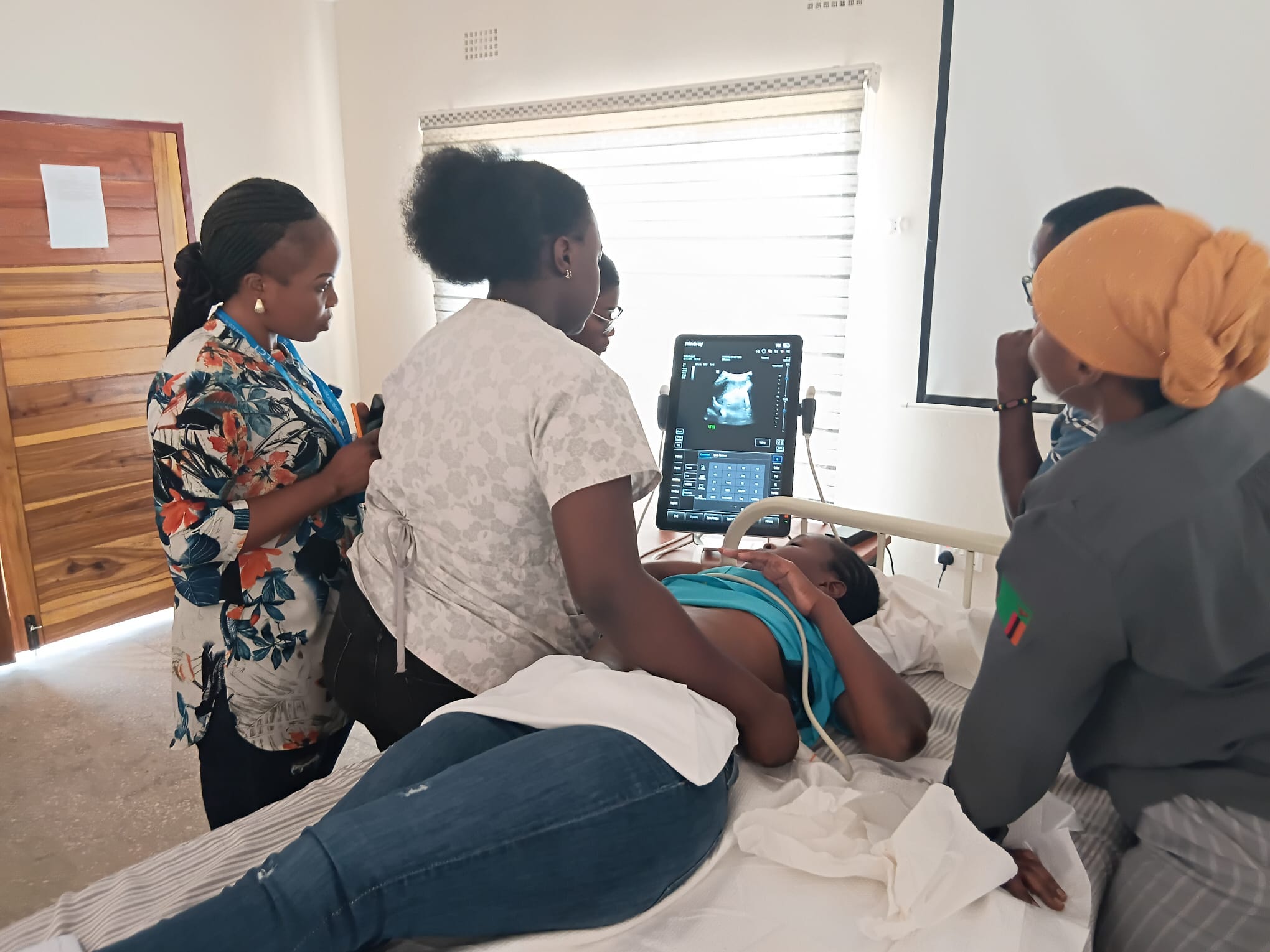 Emergency care staff at Solwezi General Hospital using the new ultrasound machine supplied by GECS during the 2025 training programme.