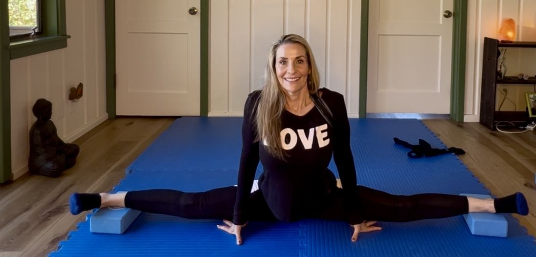 Stacey over-middle splits between two yoga blocks