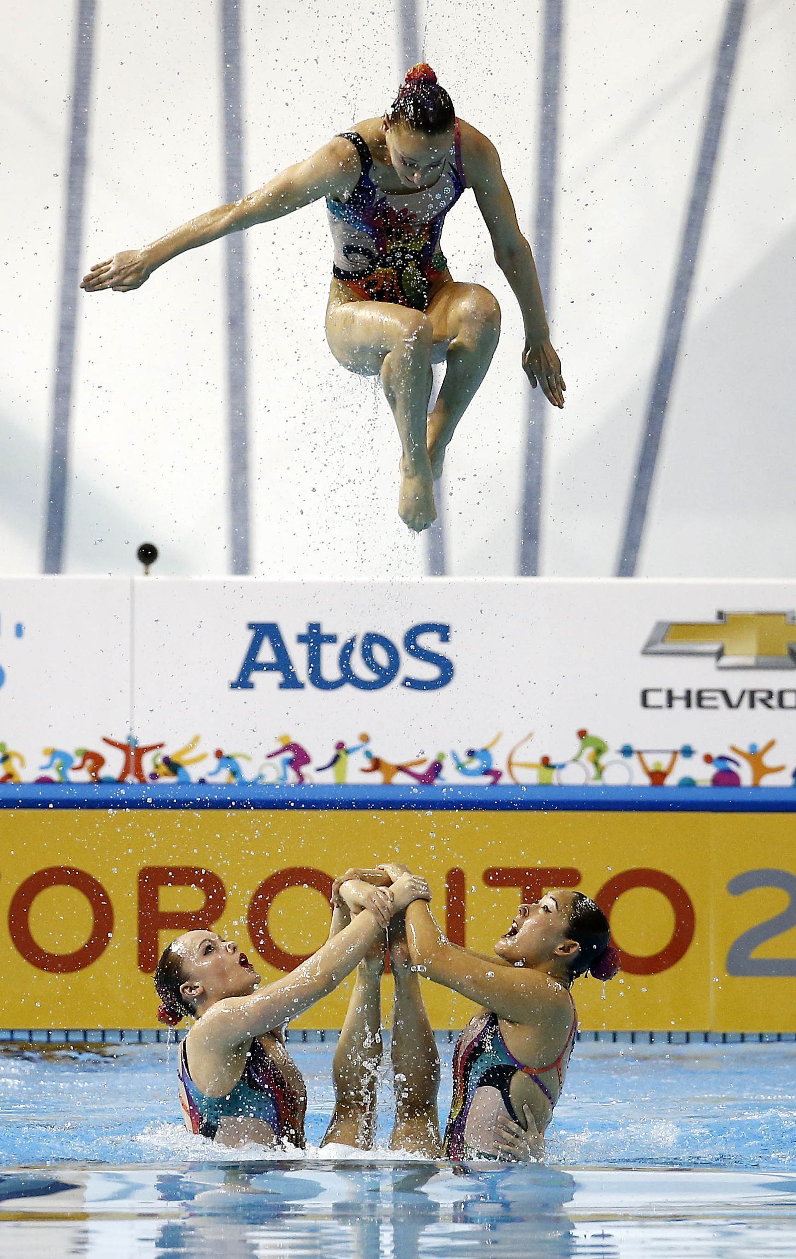 Synchronized swimmer Jessica Sobrino flyer thrown up in the air