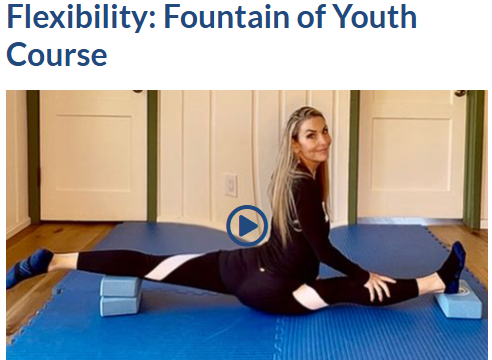 Stacey in over-splits between two yoga blocks