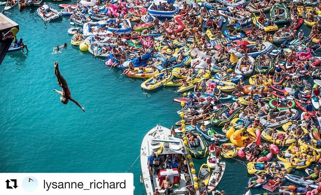 Lysanne Richard diving off cliff flying through the air to massive crowd watching in their rafts