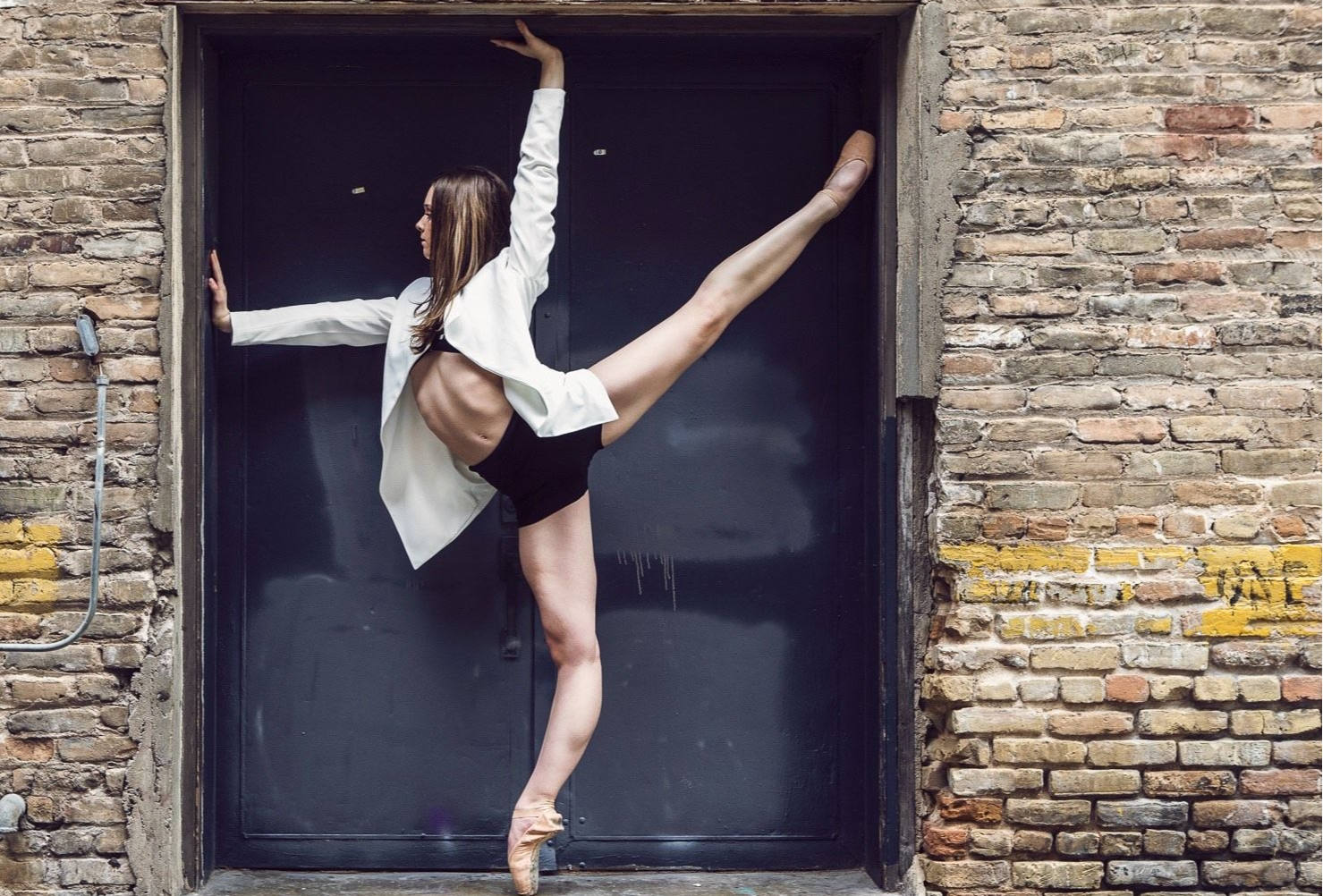 Ballerina on pointe impressive flexibility