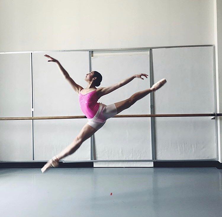 Ballerina in the air splits leap