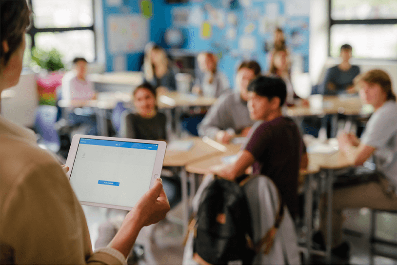 a teacher using a tablet for school