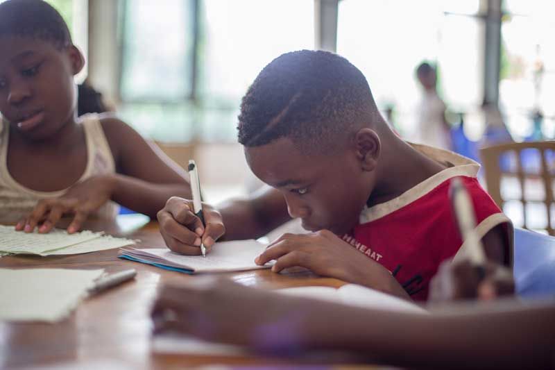 boy-writing-on-paper