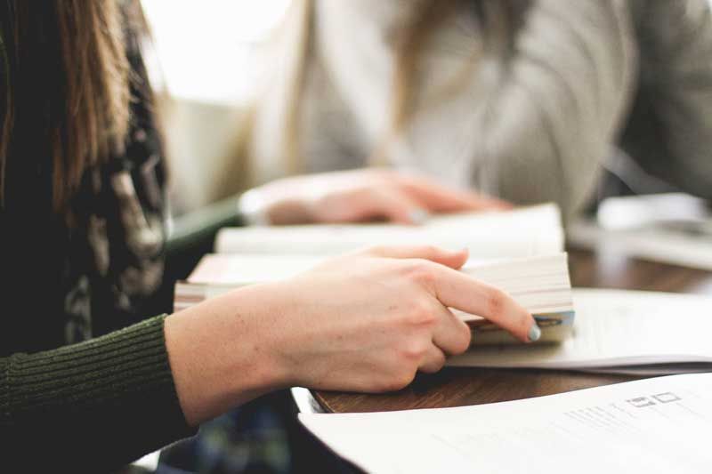 holding-open-book-in-hands