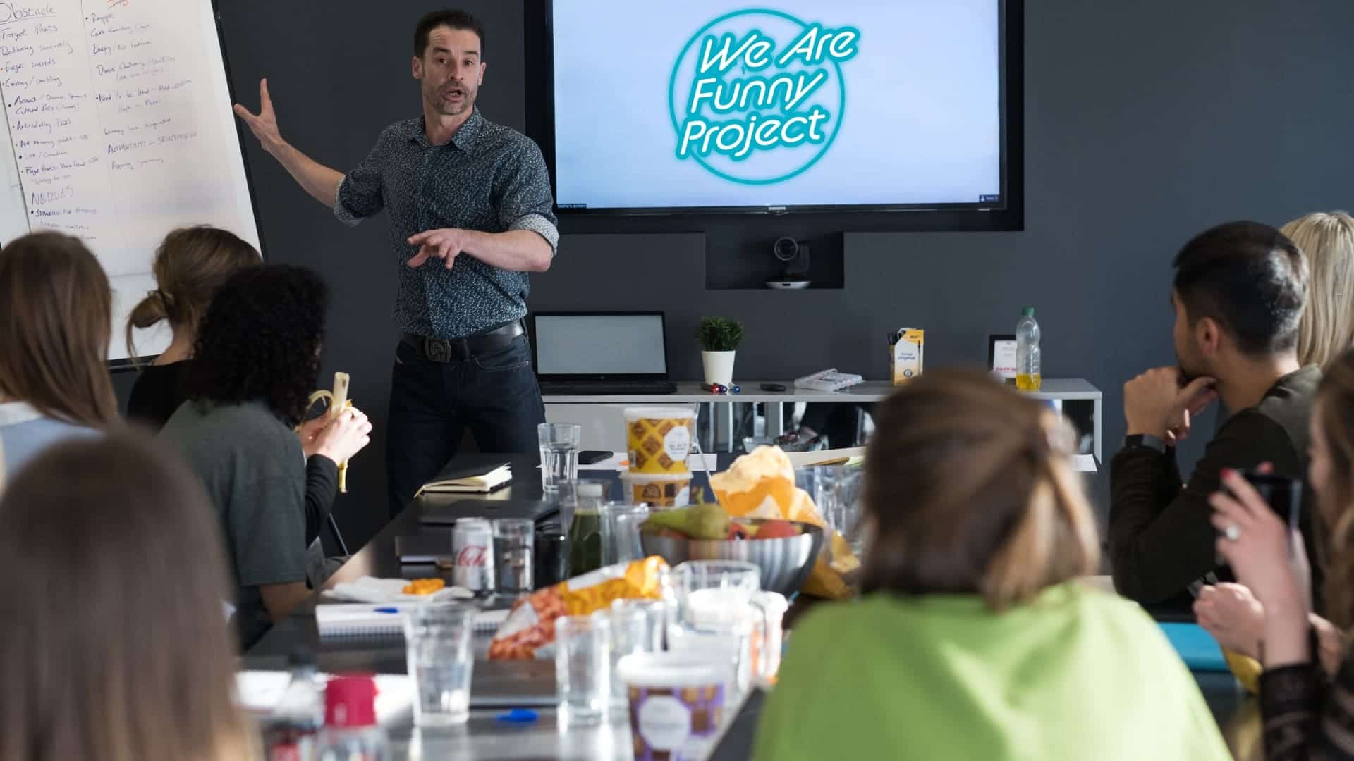 Alfie Noakes leading a business communication workshop for a group