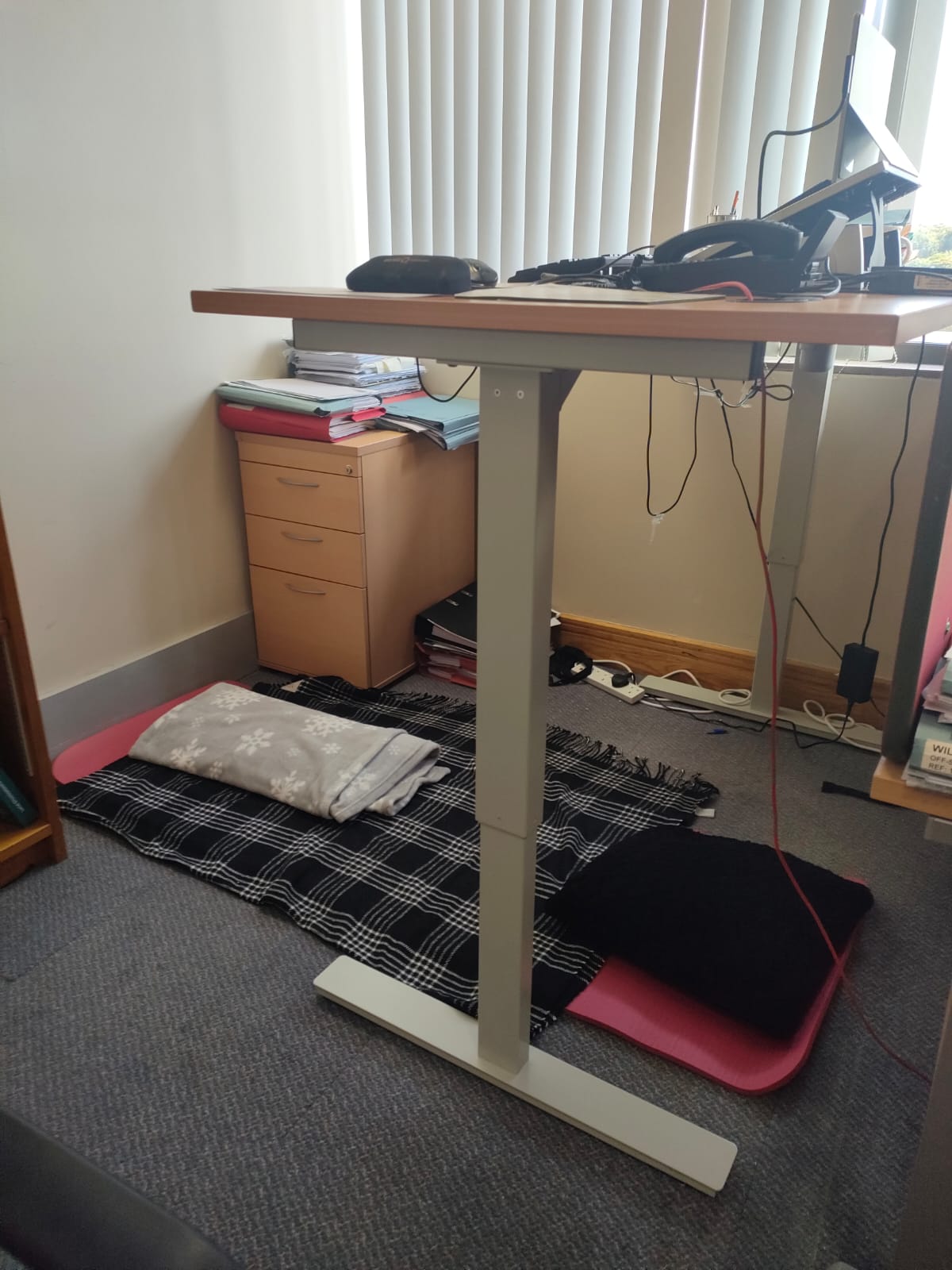 Standing desk with yoga mat below